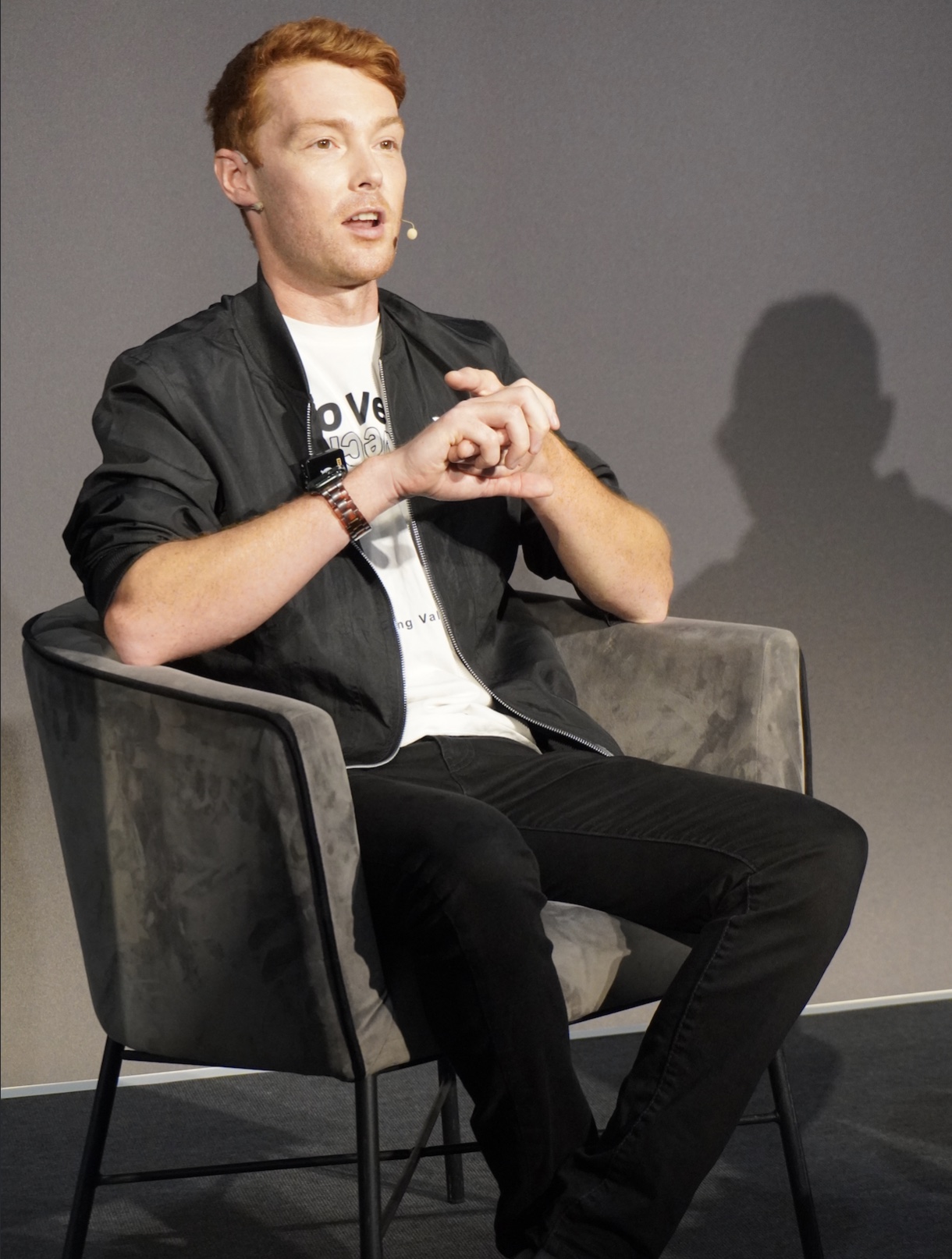 Jake Campton on stage, speaking